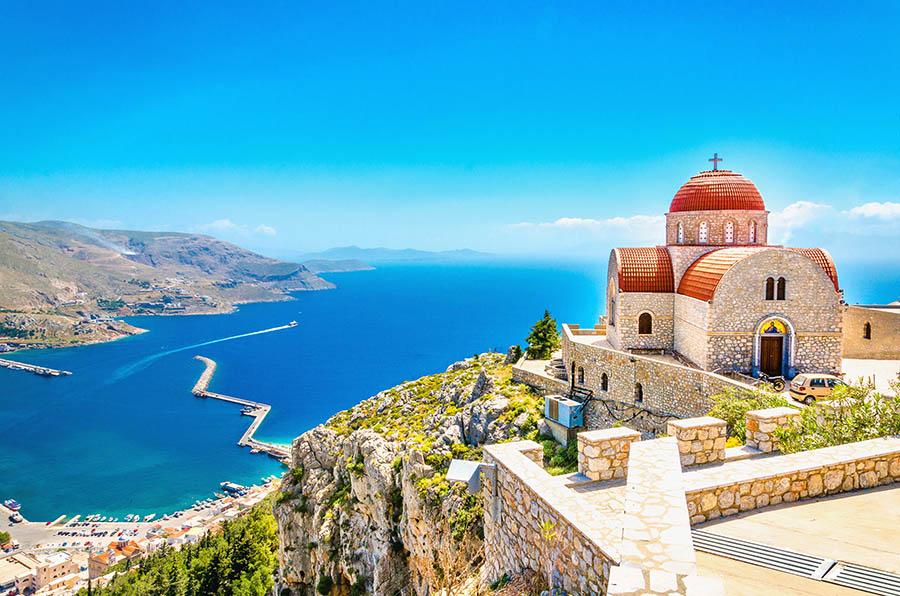 Remote church with red roofing on cliff, Greece escursioni-a-Kos